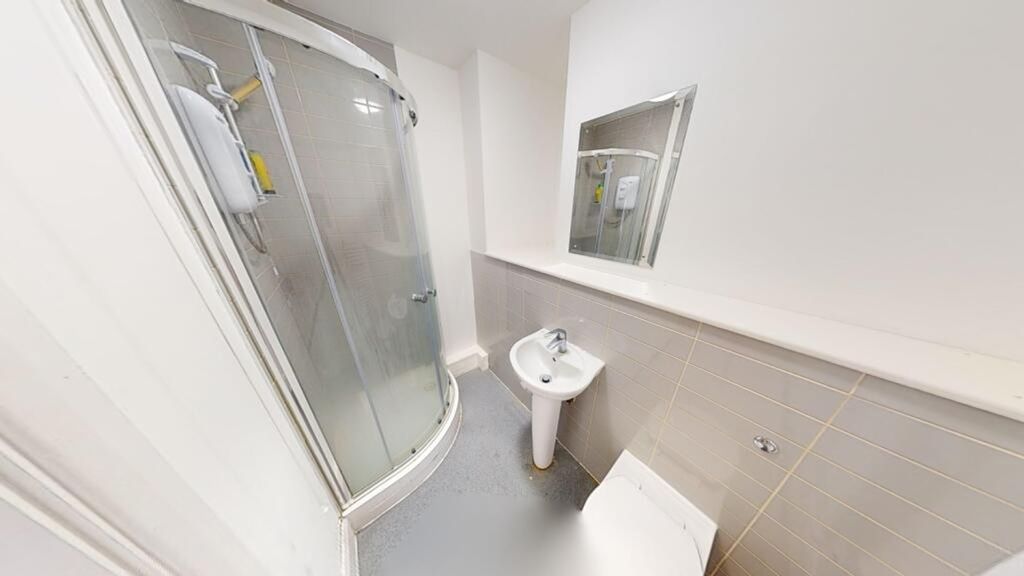 Property photo 3 of 3 Bright And Modern Bathroom Featuring A Sleek Showe...