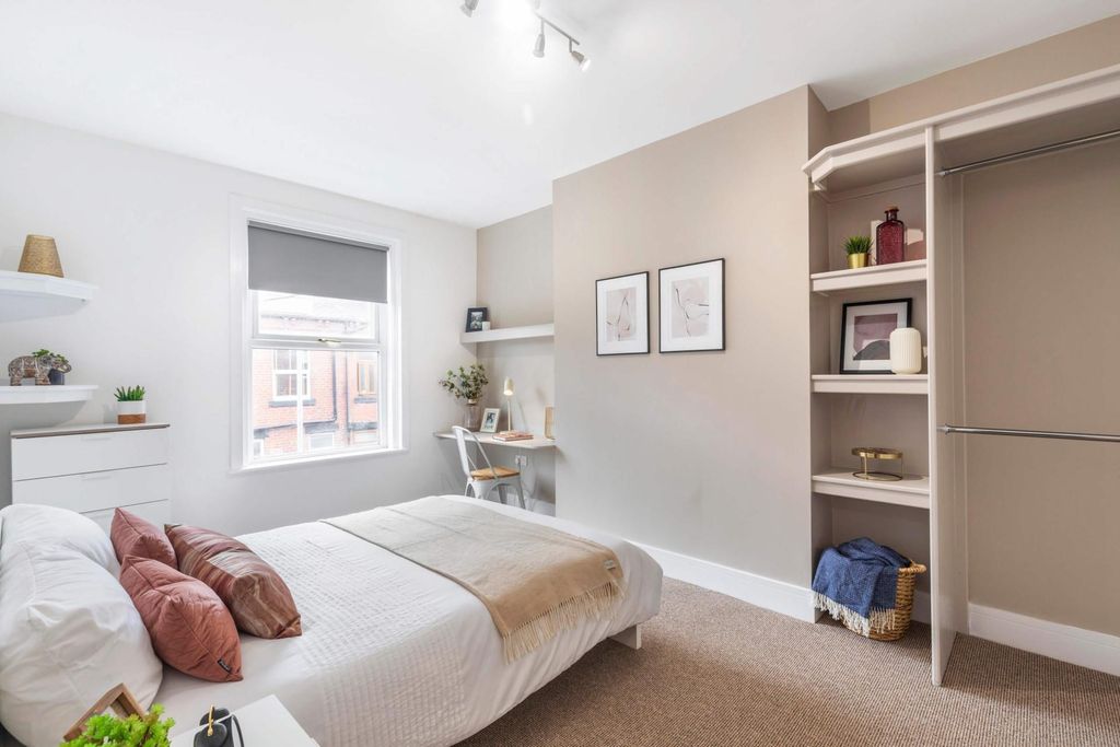 Property photo 2 of 8 A Bright, Well-Maintained Bedroom Featuring A Comf...