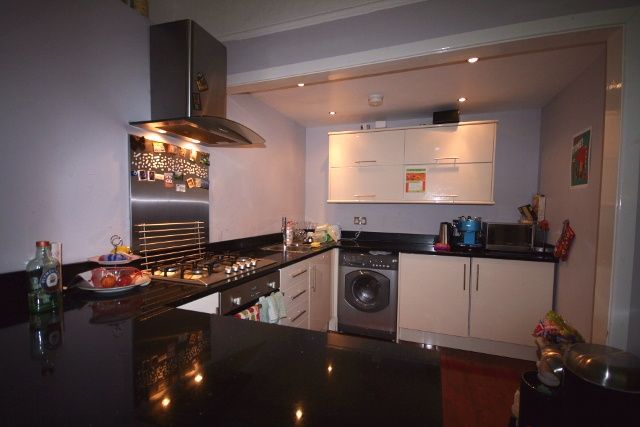 Property photo 1 of 5 Modern, Well-Lit Kitchen With Sleek White Cabinets...