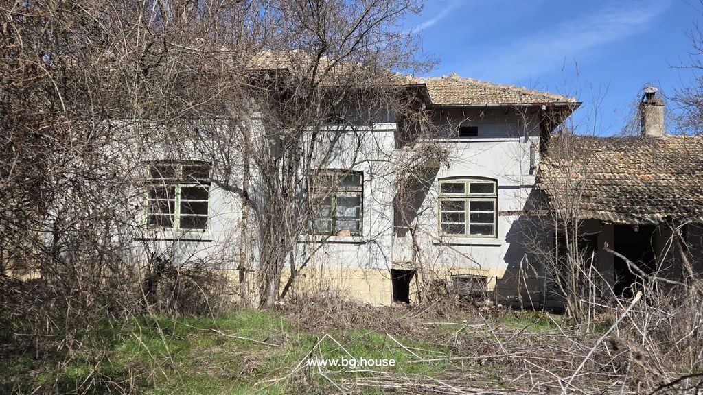 Property photo 1 of 67 Exterior View Of An Old House Showing Three Windows And Leafless Trees In Front During Winter