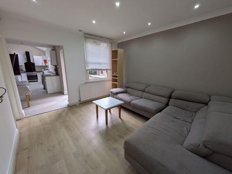 Property photo 3 of 8 A Spacious And Well-Lit Modern Living Room Featuri...