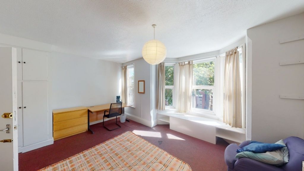 Property photo 1 of 8 Bright And Spacious Master Bedroom Featuring A Lar...