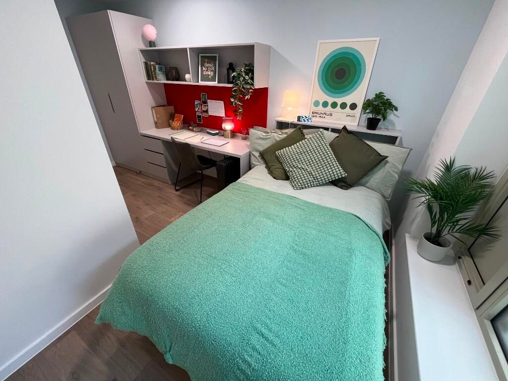 Property photo 2 of 14 Bright And Inviting Master Bedroom Featuring A Com...
