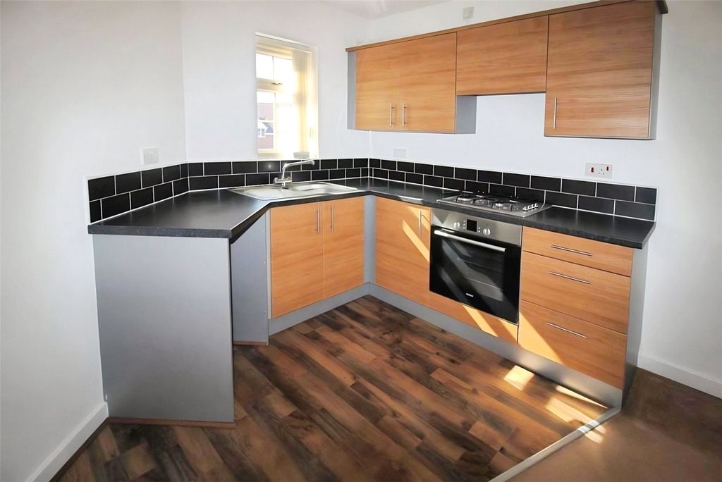 Property photo 2 of 8 Kitchen Area