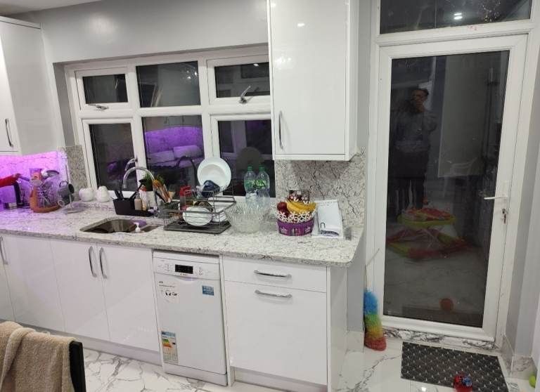 Property photo 3 of 8 Bright Modern Kitchen With Sleek White Cabinetry...