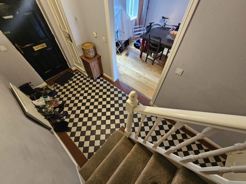Property photo 2 of 18 A Bright And Tidy Staircase Featuring Neutral Carp...