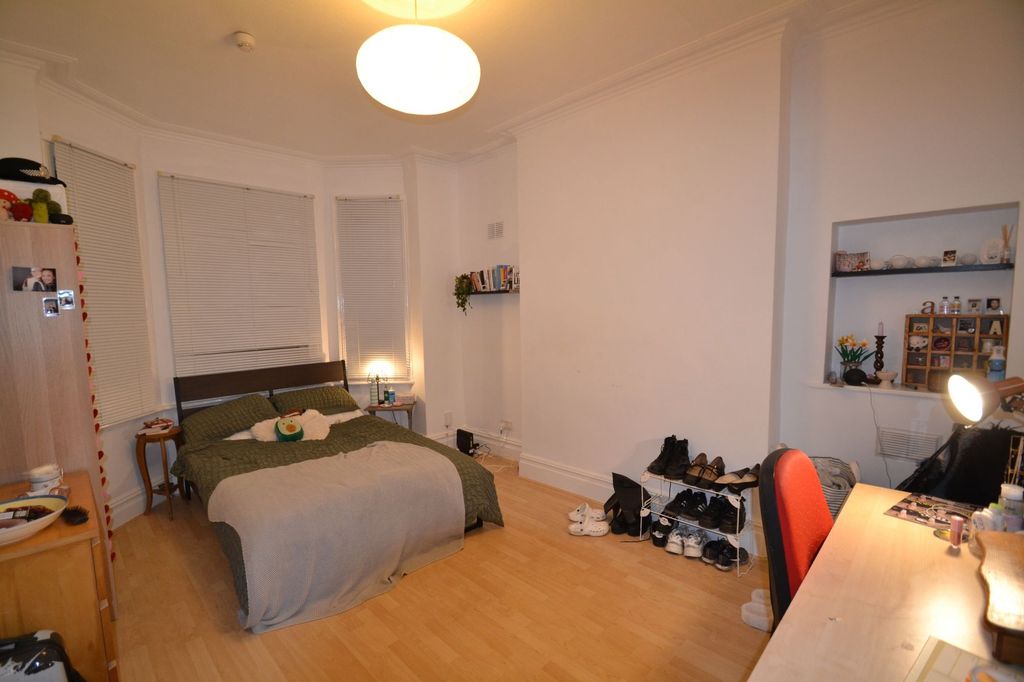 Property photo 2 of 26 A Cozy And Welcoming Living Room Featuring A Doubl...