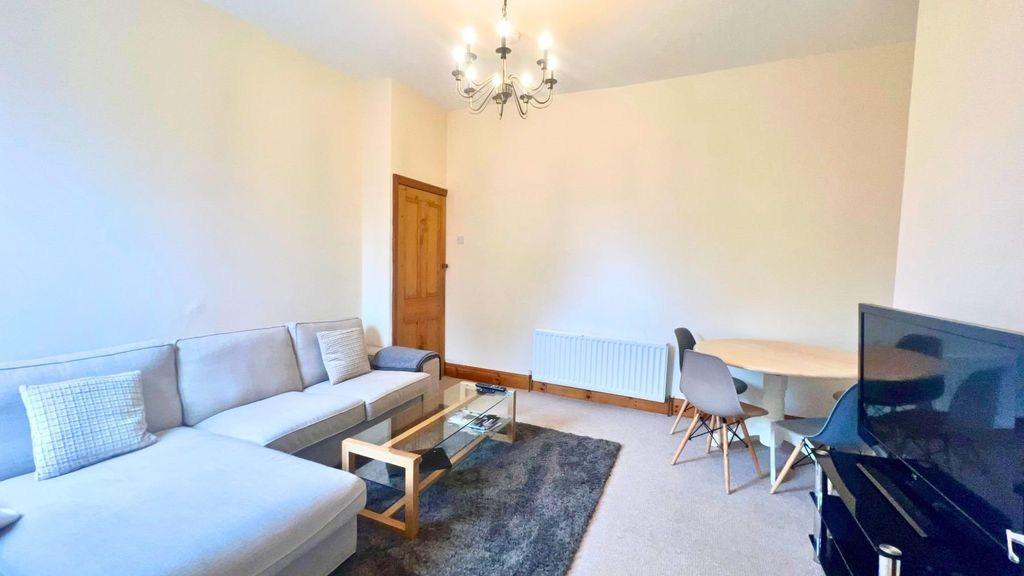 Property photo 3 of 15 A Bright And Welcoming Living Room Featuring A Lar...