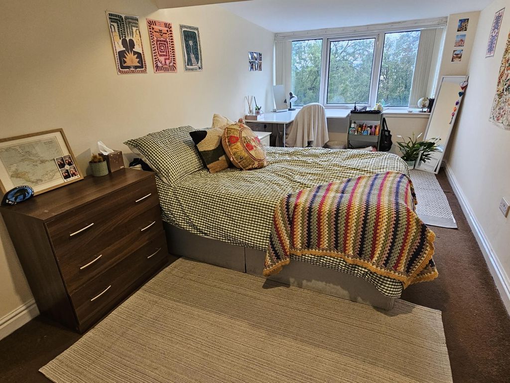 Property photo 1 of 29 A Spacious And Well-Lit Master Bedroom Featuring A...