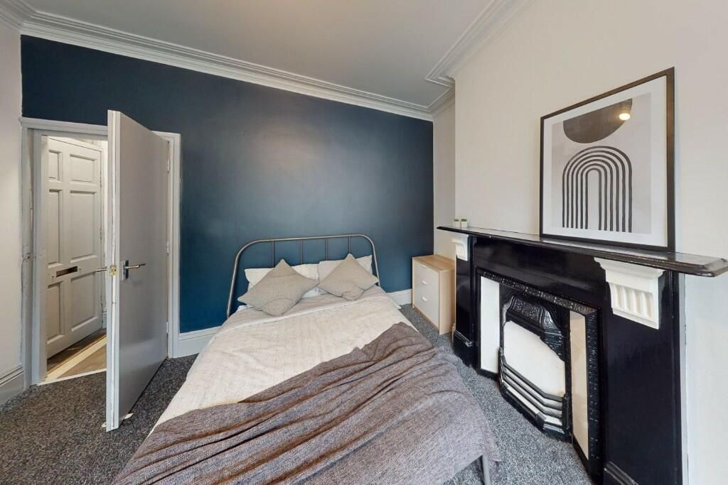 Property photo 3 of 13 A Stylish And Comfortable Master Bedroom Featuring...