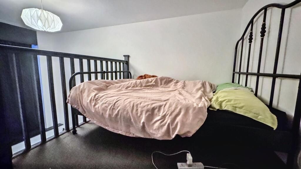 Property photo 3 of 5 Cozy Bedroom With A Raised Metal-Frame Double Bed ...