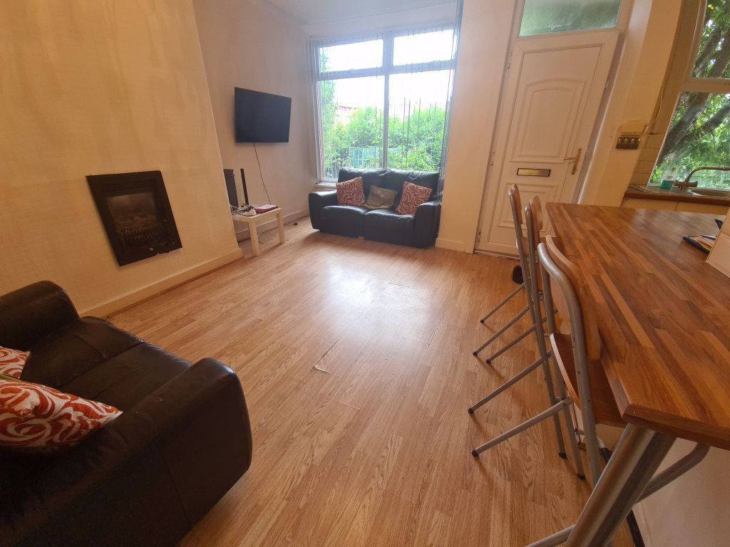 Property photo 2 of 21 Bright And Welcoming Living Room Featuring Comfort...