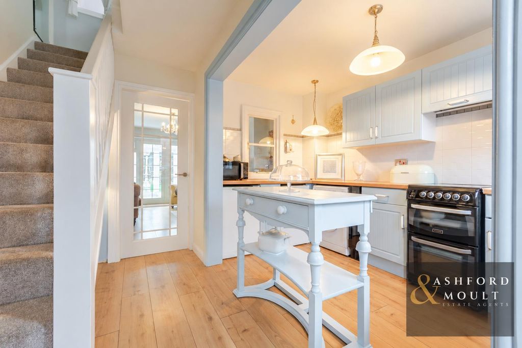 Property photo 2 of 23 Bright Cottage Kitchen With Farmhouse Island.Png
