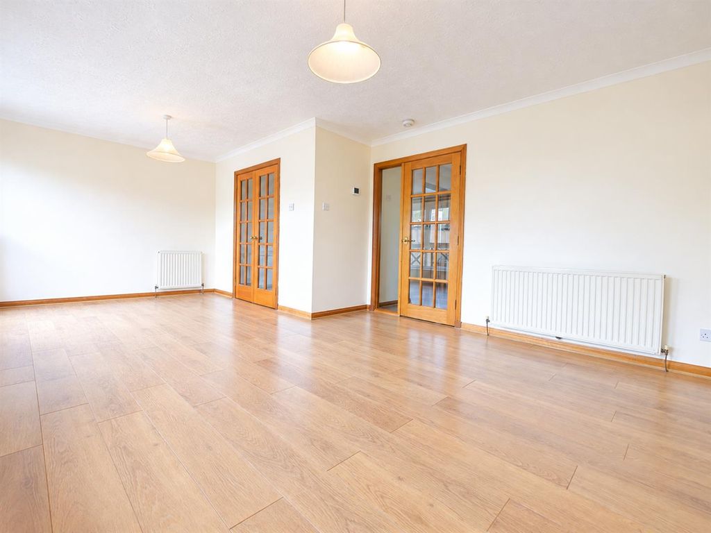 Property photo 3 of 8 Bright Minimalist Living Room With Oak Doors.Png