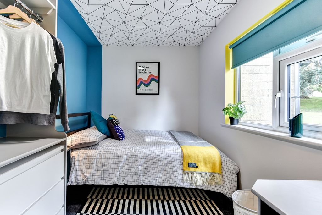 Property photo 3 of 6 A Cozy Double Bedroom Featuring A Vibrant Color Sc...