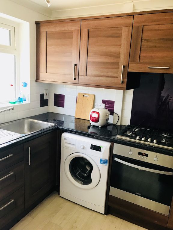Property photo 2 of 5 A Well-Maintained Kitchen Featuring Wooden Upper c...