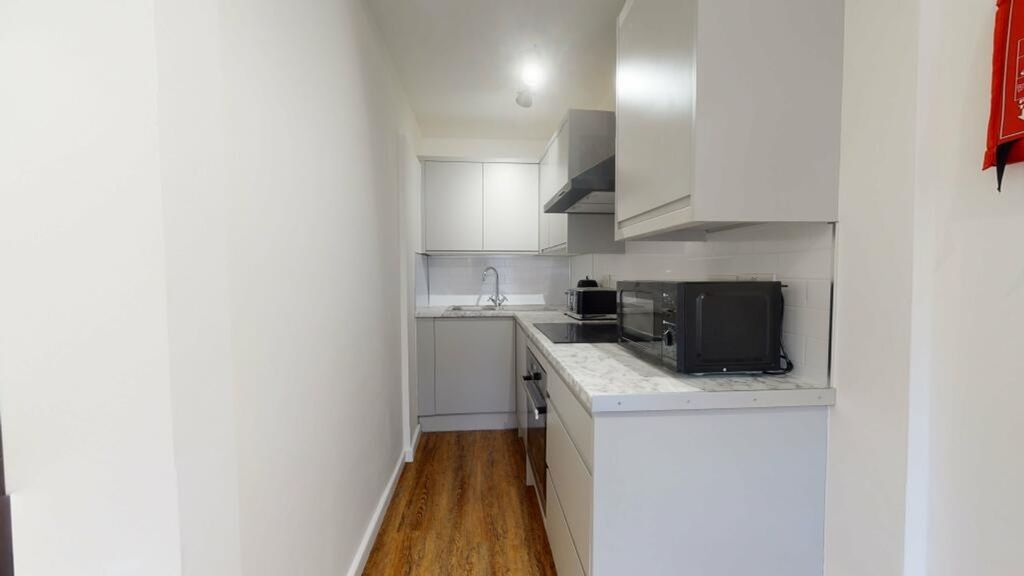 Property photo 2 of 3 A Modern And Tidy Kitchenette With Ample Storage A...