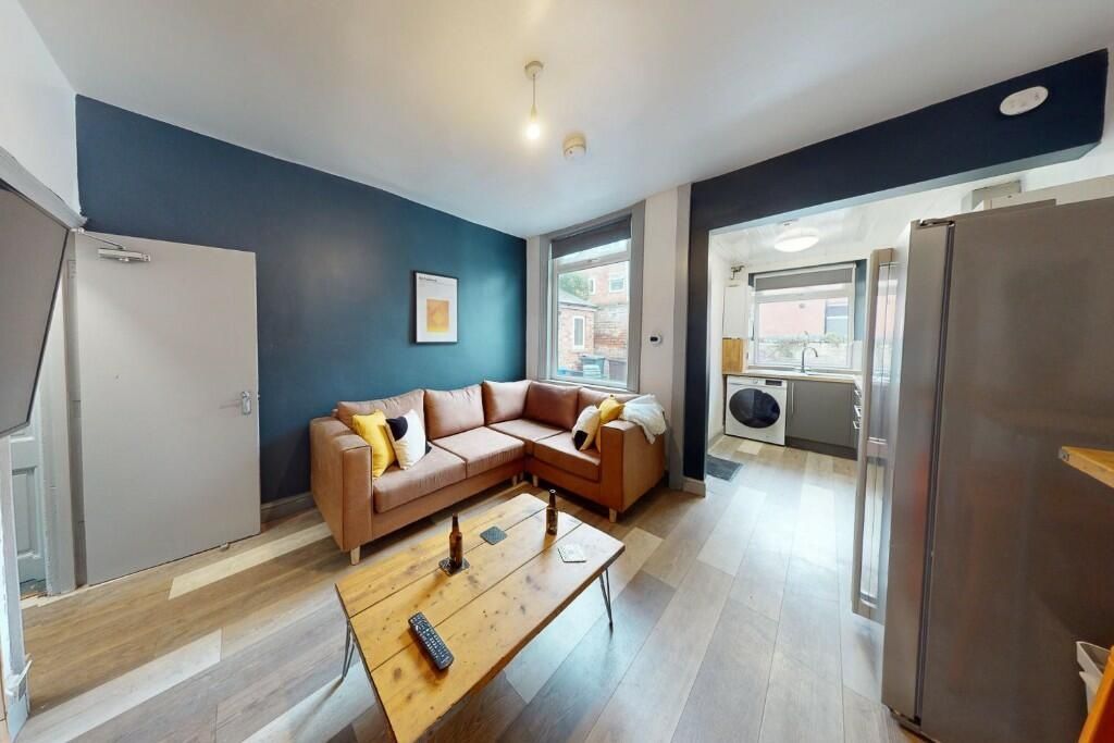 Property photo 3 of 14 A Modern Living Room Featuring A Comfortable L-Sha...