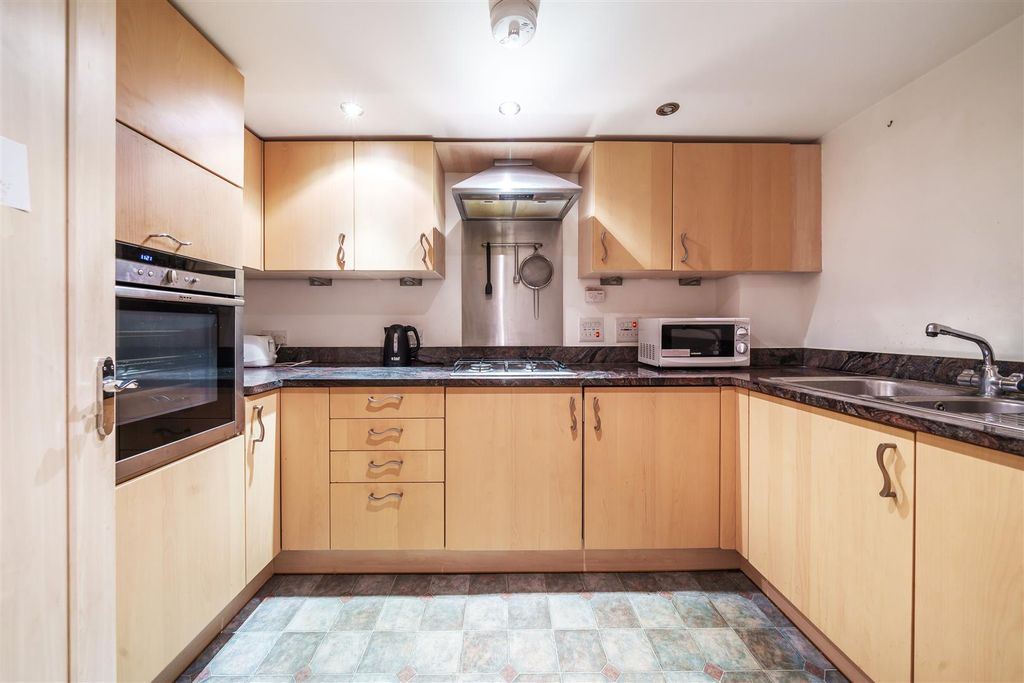 Property photo 3 of 12 Kitchen