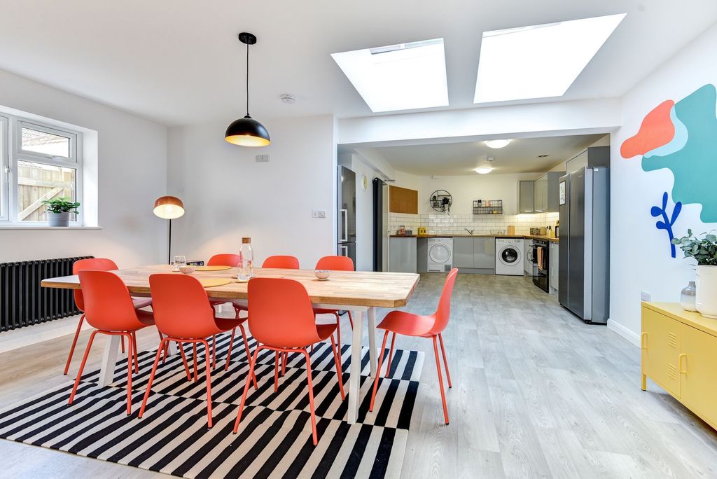 Property photo 1 of 6 Bright And Modern Kitchen Featuring A Spacious Din...