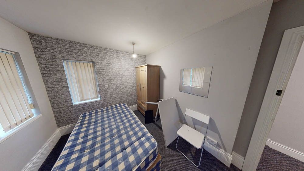 Property photo 2 of 7 A Bright And Inviting Bedroom Featuring A Double B...