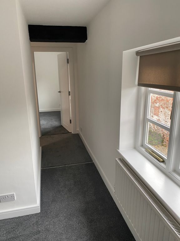 Property photo 2 of 16 Hallway Leading To Second Bedroom