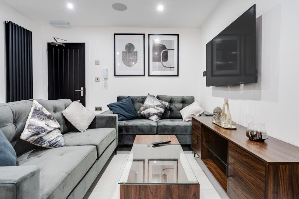 Property photo 2 of 15 This Stylish Living Room Features Contemporary Fur...