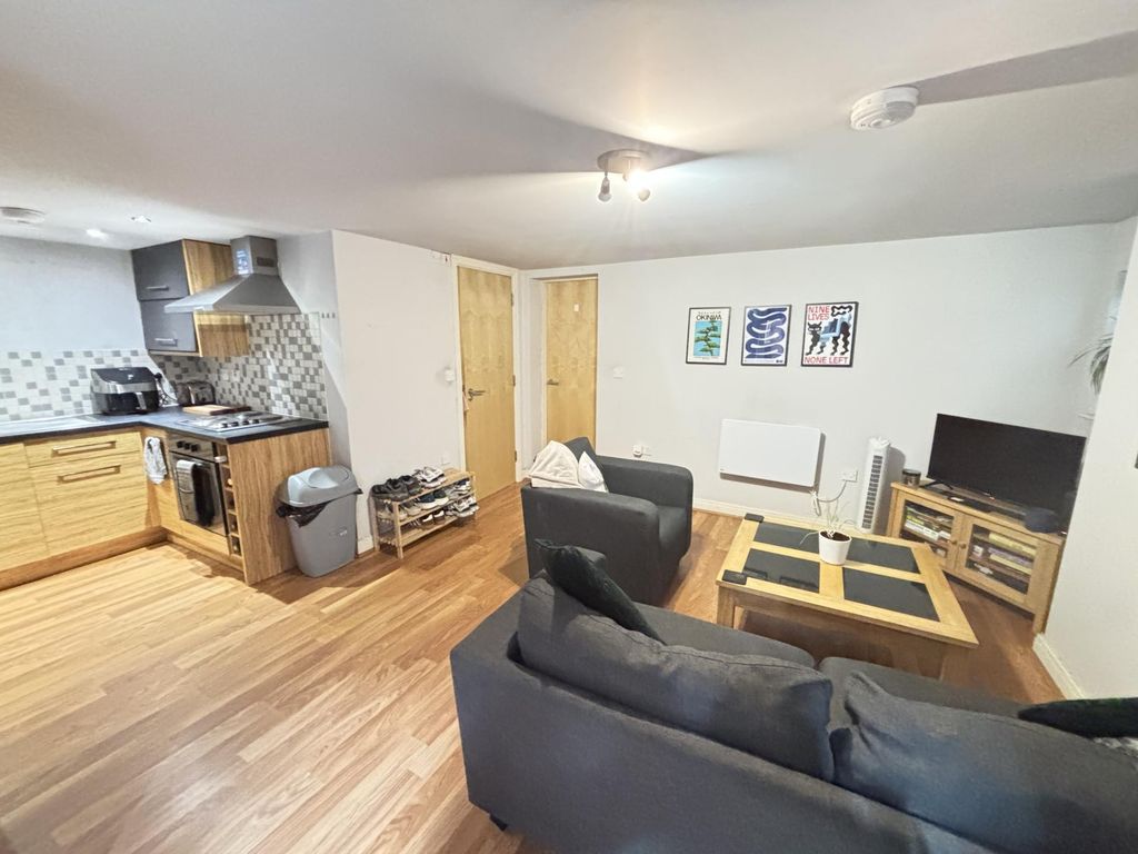 Property photo 3 of 18 A Spacious, Modern Living Room Featuring Comfortab...