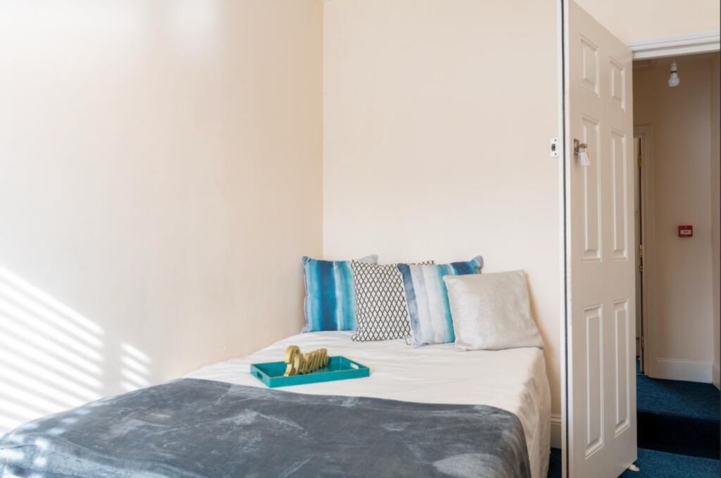 Property photo 1 of 7 A Cozy Double Bedroom Featuring Large Windows That...