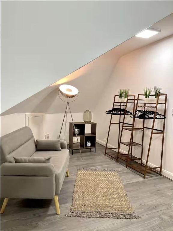 Property photo 3 of 8 A Modern Communal Lounge Featuring A Cozy Grey Sof...