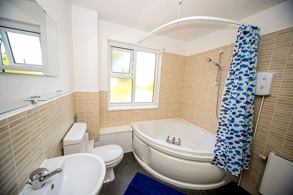 Property photo 2 of 6 A Bright And Clean Bathroom Featuring A Stylish Ba...