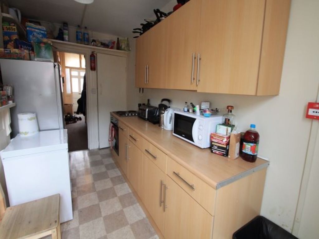 Property photo 2 of 9 A Tidy, Well-Organized Kitchen Featuring Light Woo...