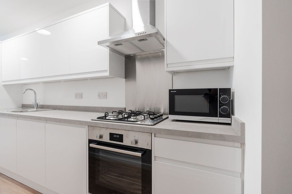 Property photo 2 of 3 Modern White Kitchen With Integrated Oven, Gas Hob...