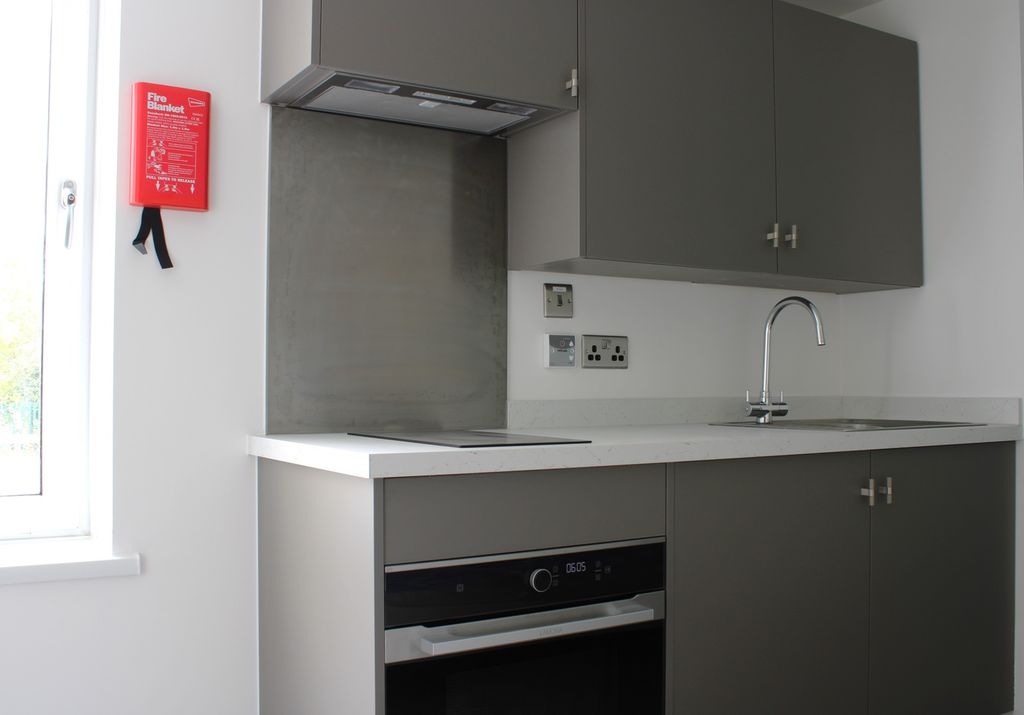Property photo 2 of 4 A Modern Kitchenette With Sleek Cabinetry And Ampl...