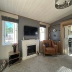 Property photo 3 of 7 Comfortable Lounge With Feature Fireplace And Wall Mounted Tv