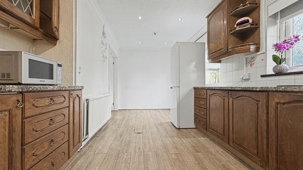 Property photo 3 of 15 Bright, Well-Maintained Kitchen With Warm Wooden c...