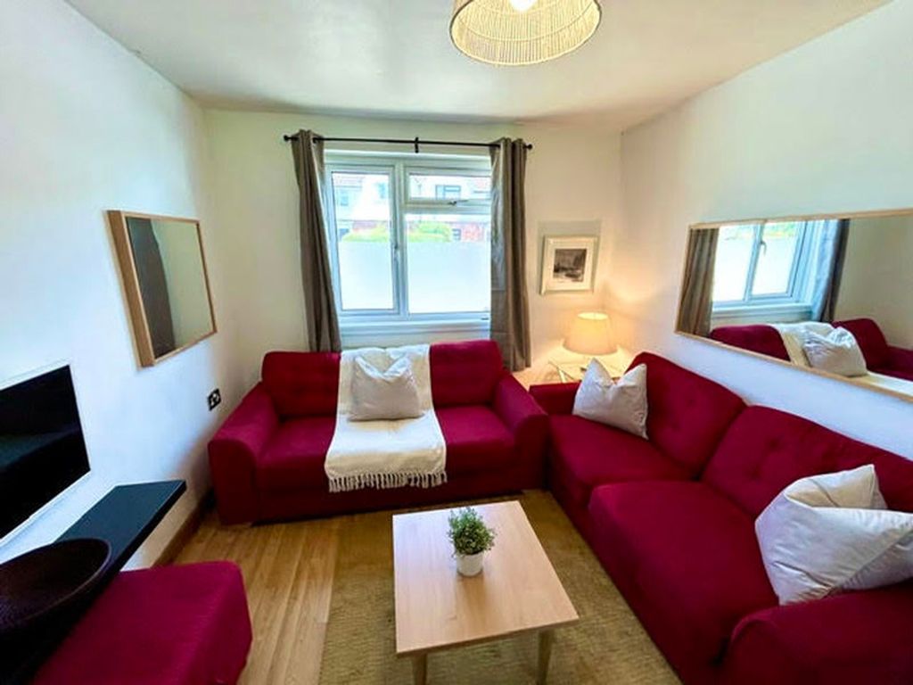 Property photo 1 of 6 This Inviting Living Room Features A Cozy Arrangem...