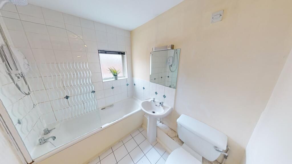 Property photo 2 of 6 Bright And Clean Bathroom Suite Featuring A Modern...