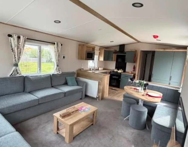 Property photo 2 of 12 Spacious Modern Lounge With Corner Seating And Adjoining Dining Area