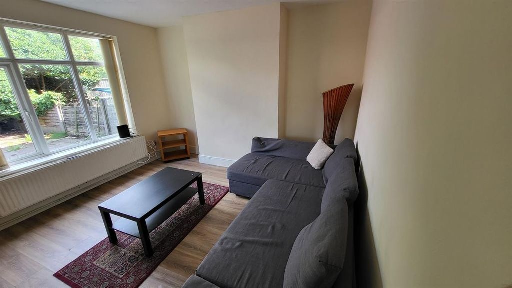 Property photo 3 of 11 A Bright And Tidy Living Room Featuring A Large Se...