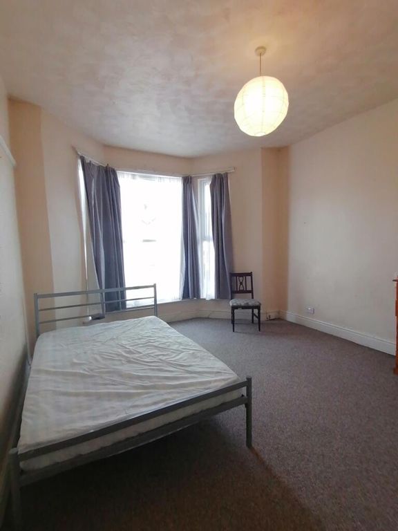 Property photo 2 of 9 Spacious Double Bedroom Featuring Large Windows Th...
