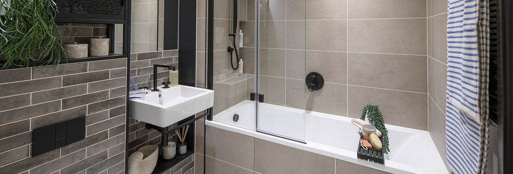 Property photo 1 of 5 Heron Wharf, Property B1-03-03, Spacious Bathroom With A Dark Design