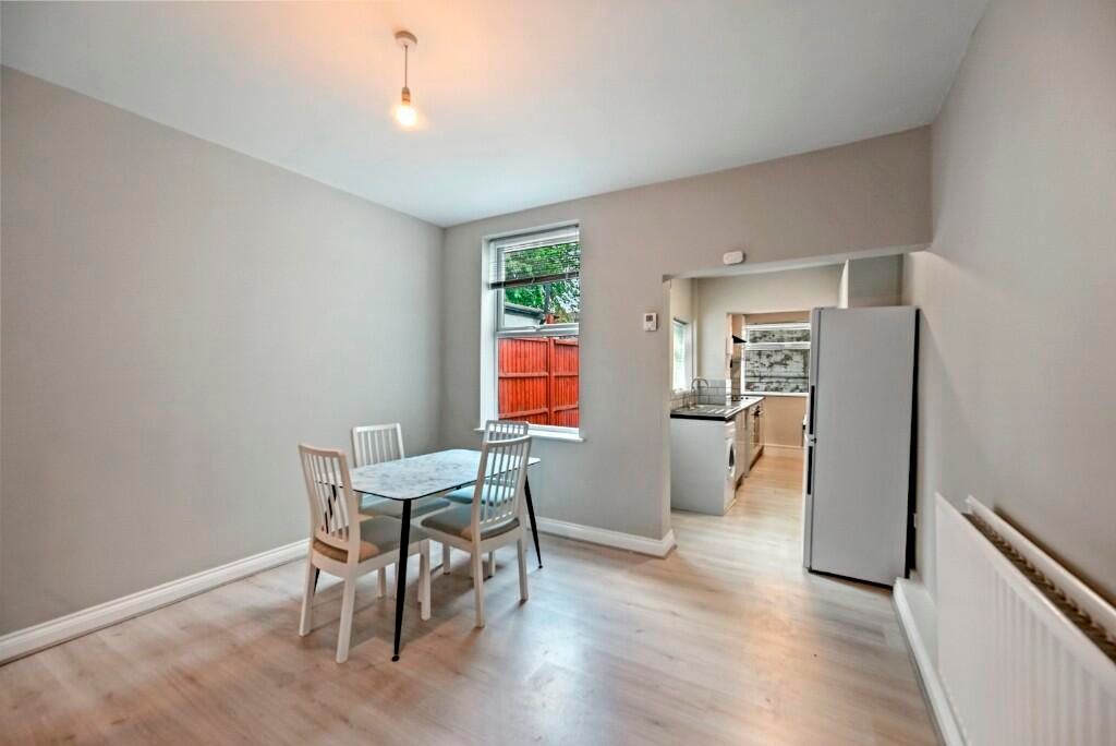 Property photo 3 of 15 Bright And Tidy Dining Area Adjacent To A Modern K...