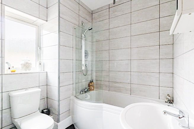 Property photo 1 of 6 Bright, Modern Bathroom With A Curved Shower-Bath,...