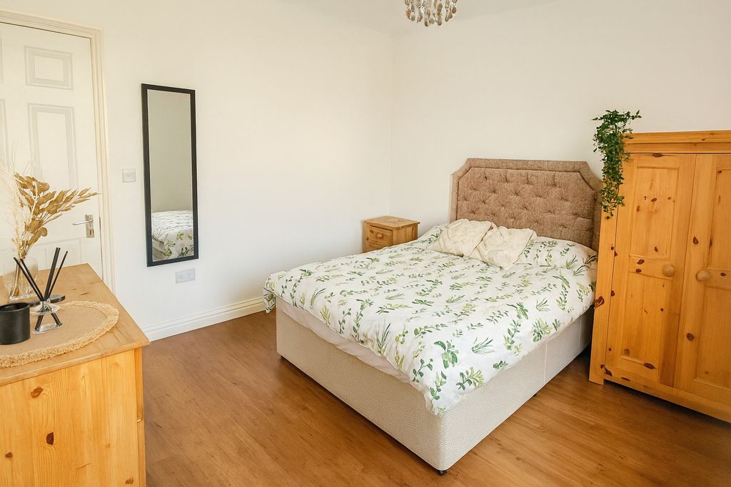 Property photo 2 of 9 Bright And Cozy Master Bedroom Featuring A Comfort...