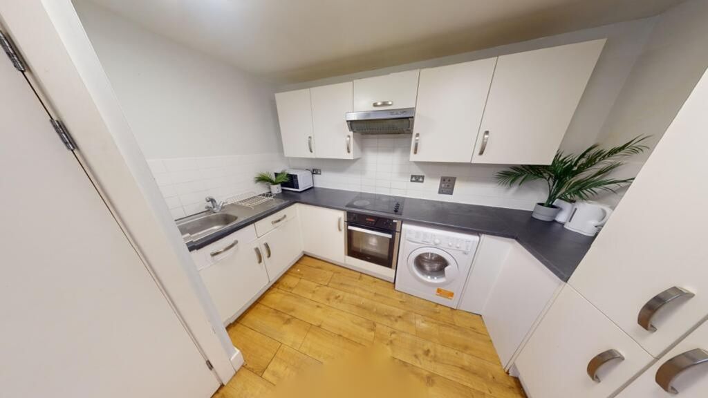 Property photo 3 of 6 A Modern And Tidy Kitchenette With Ample Storage A...