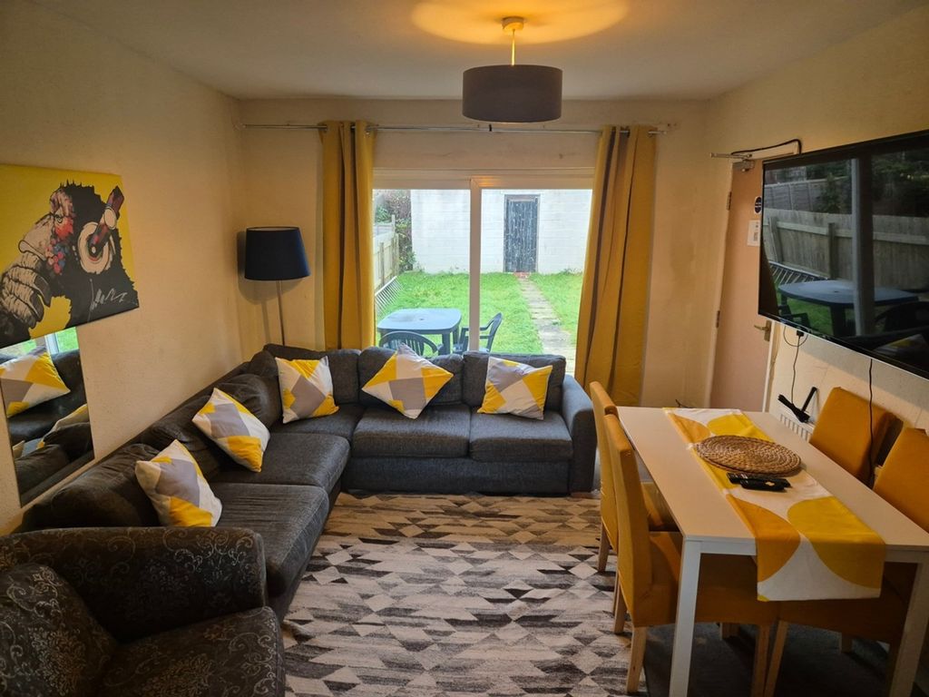 Property photo 1 of 12 A Spacious And Inviting Modern Living Room With Am...