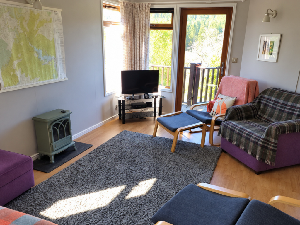 Property photo 2 of 11 Bright Lodge Lounge With Doors Opening Onto The Decking