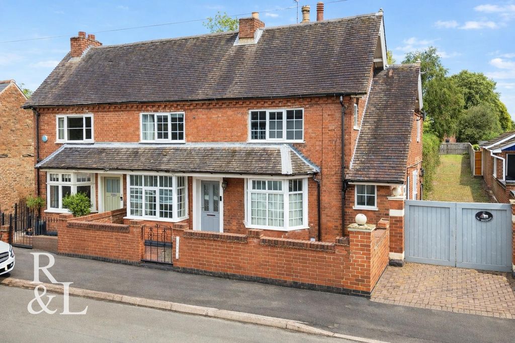 Property photo 1 of 35 Symmetrical Brick Houses In Sunlight.Jpg