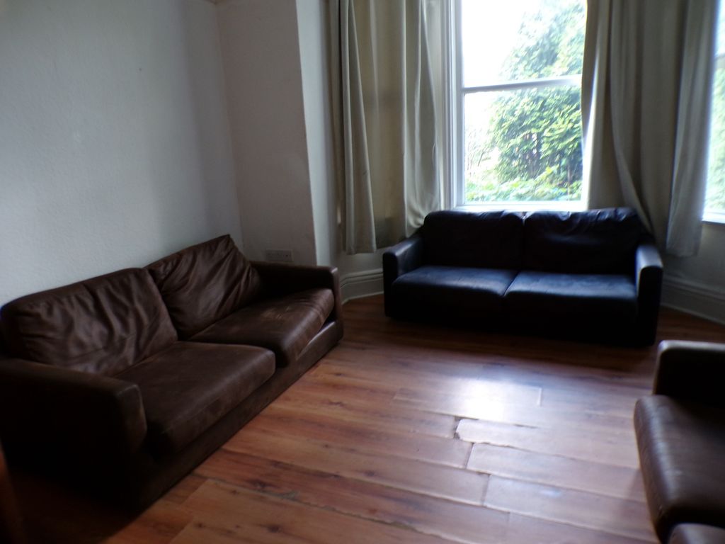 Property photo 2 of 11 A Spacious And Inviting Living Room With Ample Sea...